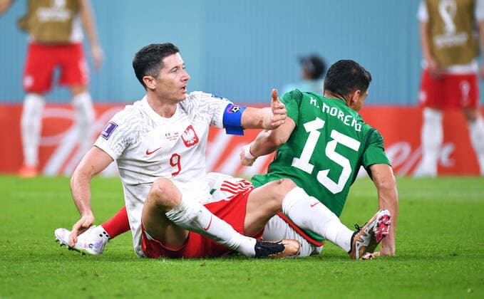 Football, World Cup, 2022, Men, Qatar, Group C, Matchday 1, Stadium 974 Mexico Poland 0 0 Robert Lewandowski POL and Hector Moreno MEX after foul action FIFA REGULATES PROHIBIT ANY USE OF PHOTOGRAPHS AS IMAGE SEQUENCES AND OR QUASI VIDEO