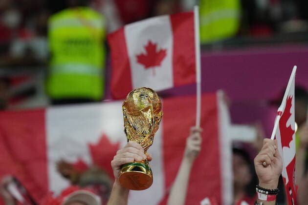November 23, 2022, Al Rayyan, Qatar: A Canada fan holds a replica World Cup trophy as they cheer ahead of Group F World Cup soccer action between Canada and Belgium at Ahmad bin Ali Stadium in Al Rayyan, Qatar, on Wednesday, Nov. 23, 2022. Canada News - November 23, 2022  - ZUMAc35_ 20221123_zaf_c35_034 Copyright: xNathanxDenettex