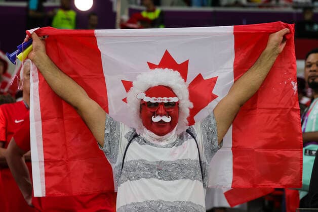 Belgium v Canada 2022 FIFA World Cup, WM, Weltmeisterschaft, Fussball A Canada fan holds a flag before the 2022 FIFA World Cup Group F match at Ahmad Bin Ali Stadium, Al-Rayyan Content Not Available For UK Newspapers Copyright: xPaulxChestertonx FIL-17640-0015 UK Newspapers OUT