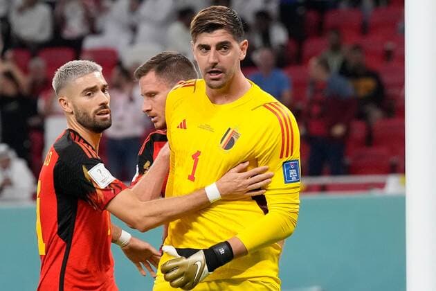 AR-RAYYAN, 23-11-2022 Ahmad Bin Ali Stadium, World Cup 2022 in Qatar game between Belgium and Canada, Belgium goalkeeper Thibaut Courtois with Belgium player Yannick Carrasco after stopping the penalty kick during the match Belgium - Canada  x19314179x Copyright: