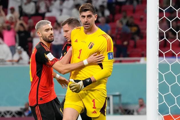 AR-RAYYAN, 23-11-2022 Ahmad Bin Ali Stadium, World Cup 2022 in Qatar game between Belgium and Canada, Belgium goalkeeper Thibaut Courtois with Belgium player Yannick Carrasco after stopping the penalty kick during the match Belgium - Canada  x19314181x Copyright: