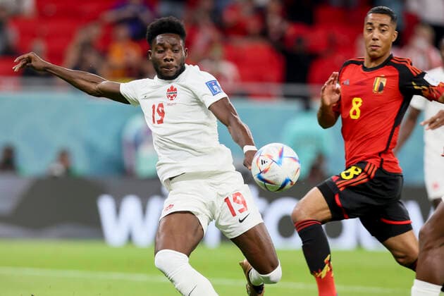Canadian Alphonso Davies and Belgium s Youri Tielemans pictured in action during a soccer game between Belgium s national team, Nationalteam the Red Devils and Canada, in Group F of the FIFA 2022 World Cup in Al Rayyan, State of Qatar on Wednesday 23 November 2022. BRUNOxFAHY  x53206887x