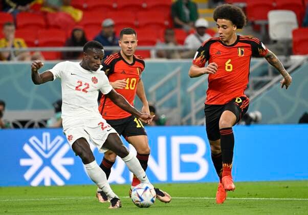 DOHA, QATAR - NOVEMBER 23 : Laryea Richie defender of Canada & Witsel Axel midfielder of Belgium during the FIFA World Cup, WM, Weltmeisterschaft, Fussball Qatar 2022 Groupe F match between Belgium and Canada at the Ahmad Bin Ali Stadium on November 23, 2022 in Doha, Qatar, 23 11 2022 ( Belgium v Canada - FIFA World Cup Qatar 2022 PhotoNews Panoramic 