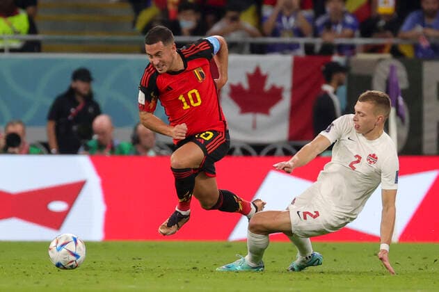 Belgium s Eden Hazard and Canadian Alistair Johnston pictured in action during a soccer game between Belgium s national team, Nationalteam the Red Devils and Canada, in Group F of the FIFA 2022 World Cup in Al Rayyan, State of Qatar on Wednesday 23 November 2022. VIRGINIExLEFOUR  x53208683x
