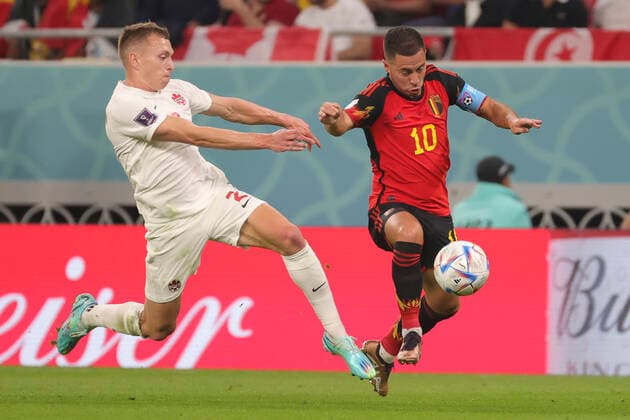 Canadian Alistair Johnston and Belgium s Eden Hazard pictured in action during a soccer game between Belgium s national team, Nationalteam the Red Devils and Canada, in Group F of the FIFA 2022 World Cup in Al Rayyan, State of Qatar on Wednesday 23 November 2022. VIRGINIExLEFOUR  x53209851x