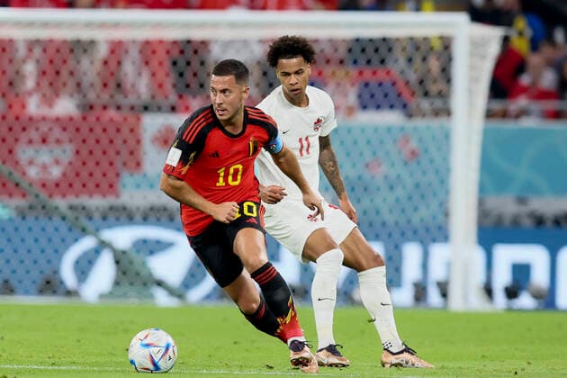 Belgium s Eden Hazard and Canadian Tajon Buchanan pictured in action during a soccer game between Belgium s national team, Nationalteam the Red Devils and Canada, in Group F of the FIFA 2022 World Cup in Al Rayyan, State of Qatar on Wednesday 23 November 2022. BRUNOxFAHY  x53209050x