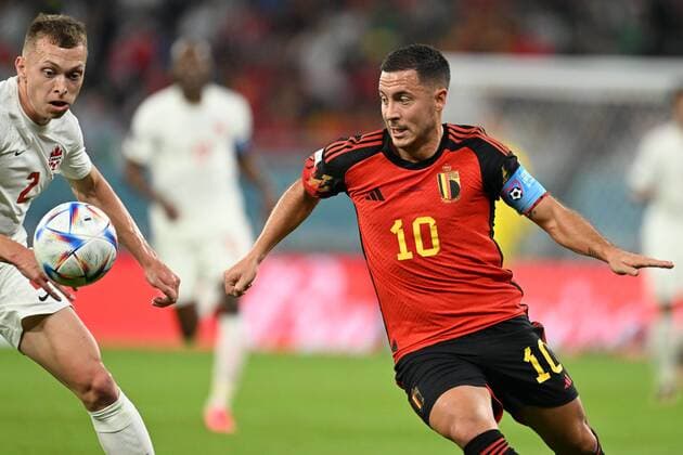 DOHA, QATAR - NOVEMBER 23 : Hazard Eden midfielder of Belgium in action with Johnston Alistair defender of Canada during the FIFA World Cup, WM, Weltmeisterschaft, Fussball Qatar 2022 Groupe F match between Belgium and Canada at the Ahmad Bin Ali Stadium on November 23, 2022 in Doha, Qatar, 23 11 2022 ( Belgium v Canada - FIFA World Cup Qatar 2022 PhotoNews Panoramic 