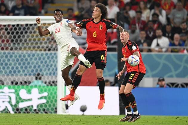 DOHA, QATAR - NOVEMBER 23 : David Jonathan forward of Canada and Witsel Axel midfielder of Belgium jumping towards the ball during the FIFA World Cup, WM, Weltmeisterschaft, Fussball Qatar 2022 Groupe F match between Belgium and Canada at the Ahmad Bin Ali Stadium on November 23, 2022 in Doha, Qatar, 23 11 2022 ( Belgium v Canada - FIFA World Cup Qatar 2022 PhotoNews Panoramic 