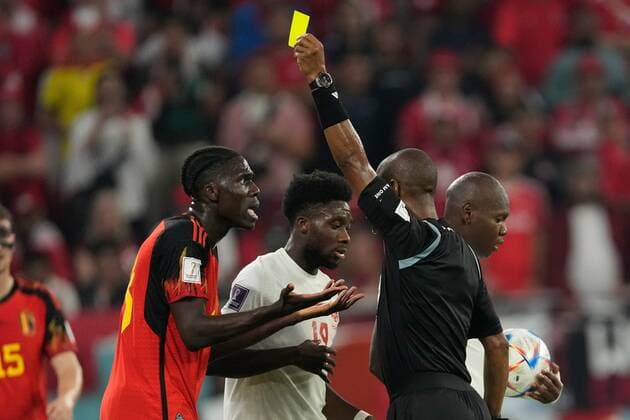 AR-RAYYAN, 23-11-2022 Ahmad Bin Ali Stadium, World Cup 2022 in Qatar game between Belgium and Canada, yellow card Belgium player Amadou Onana from referee Janny Sikazwe during the match Belgium - Canada  x19314453x Copyright:
