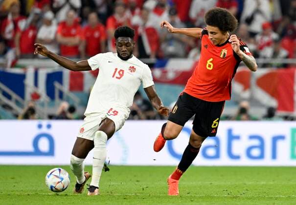 DOHA, QATAR - NOVEMBER 23 : Davies Alphonso forward of Canada & Witsel Axel midfielder of Belgium during the FIFA World Cup, WM, Weltmeisterschaft, Fussball Qatar 2022 Groupe F match between Belgium and Canada at the Ahmad Bin Ali Stadium on November 23, 2022 in Doha, Qatar, 23 11 2022 ( Belgium v Canada - FIFA World Cup Qatar 2022 PhotoNews Panoramic 
