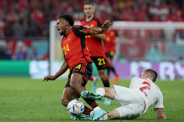 Belgium s Lois Openda in action and Canadian Alistair Johnston gets a yellow card for this tackle at a soccer game between Belgium s national team, Nationalteam the Red Devils and Canada, in Group F of the FIFA 2022 World Cup in Al Rayyan, State of Qatar on Wednesday 23 November 2022. BRUNOxFAHY  x53224036x