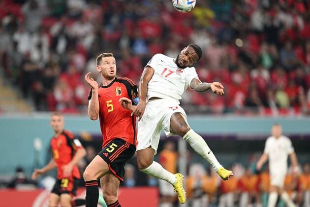 DOHA, QATAR - NOVEMBER 23 : Larin Cyle forward of Canada in an airduel with Vertonghen Jan defender of Belgium during the FIFA World Cup, WM, Weltmeisterschaft, Fussball Qatar 2022 Groupe F match between Belgium and Canada at the Ahmad Bin Ali Stadium on November 23, 2022 in Doha, Qatar, 23 11 2022 ( Belgium v Canada - FIFA World Cup Qatar 2022 PhotoNews Panoramic 