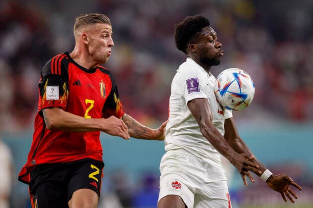 belgium vs canada AL-RAYYAN, AR - 23.11.2022: BELGIUM VS CANADA - ALDERWEIRELD Toby of Belgium disputes the ball with DAVIES Alphonso of Canada during the match between Belgium and Canada, valid for the first round of the group stage of the World Cup, held at the Ahmed bin Ali Stadium in Al-Rayyan, Qatar. (Photo: Marcelo Machado de Melo Fotoarena) x2298058x  MarceloxMachadoxdexMelo