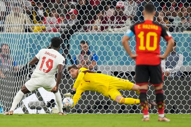 November 23, 2022, AL RAYYAN, QATAR: Belgium goalkeeper Thibaut Courtois (1) makes a save on a penalty kick from Canada forward Alphonso Davies (19) during first half Group F World Cup soccer action at Ahmad bin Ali Stadium in Al Rayyan, Qatar, on Wednesday, Nov. 23, 2022. Canada News - November 23, 2022  - ZUMAc35_ 20221123_zaf_c35_145 Copyright: xNathanxDenettex
