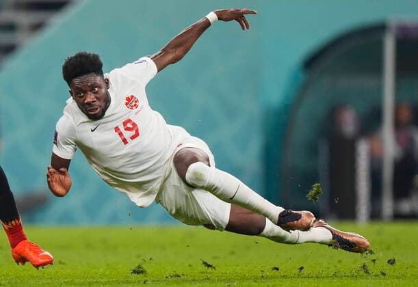 November 24, 2022, AL RAYYAN, QATAR: Canada forward Alphonso Davies (19) falls to the turf after he gets tripped up against Belgium during second half group F World Cup soccer action at the Ahmad Bin Ali Stadium in Al Rayyan, Qatar on Thursday, November 23, 2022. Canada News - November 24, 2022  - ZUMAc35_ 20221124_zaf_c35_001 Copyright: xNathanxDenettex