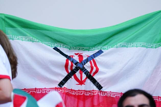 Mandatory Credit: Photo by Javier Garcia Shutterstock (13634738h) An Iranian flag with a black cross in protest Wales v Iran, FIFA World Cup, WM, Weltmeisterschaft, Fussball 2022, Group B, Football, Ahmad Bin Ali Stadium, Ar-Rayyan, Qatar - 25 Nov 2022 Editorial Use Only Wales v Iran, FIFA World Cup 2022, Group B, Football, Ahmad Bin Ali Stadium, Ar-Rayyan, Qatar - 25 Nov 2022 Editorial Use Only  Copyright: xJavierxGarcia Shutterstockx 13634738h