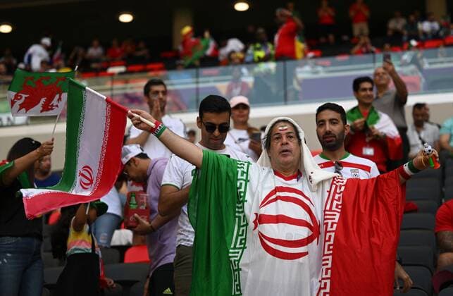 Qatar Soccer World Cup Wales - Iran 8324403 25.11.2022 An Iran s supporter waits before the start of the Qatar 2022 World Cup Group B soccer match between Wales and Iran at the Ahmad Bin Ali Stadium in Doha, Qatar. Grigory Sysoev Sputnik Ar-Rayyan Qatar  Copyright: xGrigoryxSysoevx