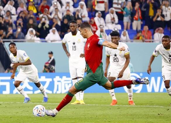 Football World Cup in Qatar Portugal s Cristiano Ronaldo scores a penalty during the second half of a World Cup Group H football match against Ghana at Stadium 974 in Doha, Qatar, on Nov. 24, 2022.  A14AA0001362145P 