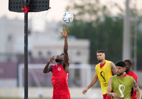 November 26, 2022, DOHA, QATAR: Canada forward Alphonso Davies, left, shoots a basket with the soccer ball during practice at the World Cup in Doha, Qatar on Saturday, November 26, 2022. Canada News - November 26, 2022  - ZUMAc35_ 20221126_zaf_c35_019 Copyright: xNathanxDenettex