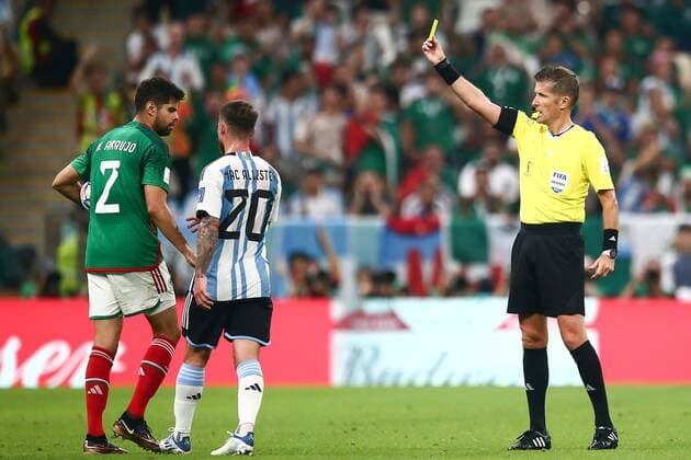 Mandatory Credit: Photo by Michael Zemanek Shutterstock (13634795ab) Nestor Araujo of Mexico is shown a yellow card by match referee Daniele Orsato Argentina v Mexico, FIFA World Cup, WM, Weltmeisterschaft, Fussball 2022, Group C, Football, Lusail Stadium, Al Daayen, Qatar - 26 Nov 2022 Editorial Use Only Argentina v Mexico, FIFA World Cup 2022, Group C, Football, Lusail Stadium, Al Daayen, Qatar - 26 Nov 2022 Editorial Use Only Copyright: xMichaelxZemanek Shutterstockx 13634795ab