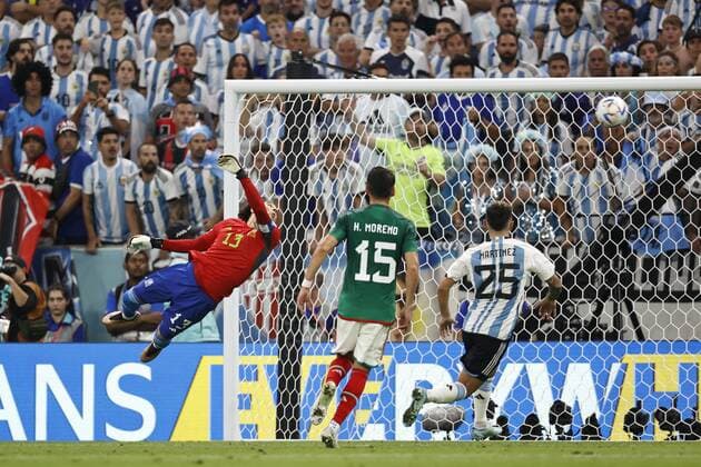 LUSAIL CITY Enzo Fernandez of Argentina not in picture scores the 2 0 lr Mexico goalkeeper Guillermo Ochoa, Hector Moreno of Mexico, Lisandro Martinez of Argentina during the FIFA World Cup Qatar 2022 group C match between Argentina and Mexico at the Lusail Stadium on November 26, 2022 in Lusail City, Qatar AP Dutch Height MAURICE OF STONE FIFA World Cup Qatar 2022 2022 xVIxANPxSportx xMauricexvanxSteenxWKxIVx 458393173 originalFilename: 458393173.jpg