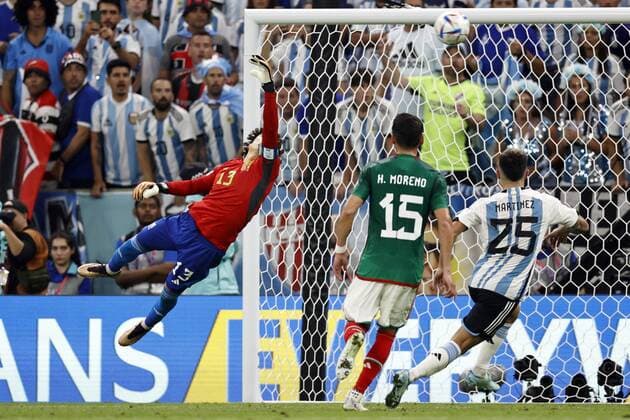 LUSAIL CITY Enzo Fernandez of Argentina not in picture scores the 2 0 lr Mexico goalkeeper Guillermo Ochoa, Hector Moreno of Mexico, Lisandro Martinez of Argentina during the FIFA World Cup Qatar 2022 group C match between Argentina and Mexico at the Lusail Stadium on November 26, 2022 in Lusail City, Qatar AP Dutch Height MAURICE OF STONE FIFA World Cup Qatar 2022 2022 xVIxANPxSportx xMauricexvanxSteenxWKxIVx 458393278 originalFilename: 458393278.jpg