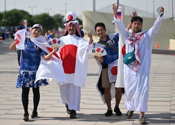 Qatar Soccer World Cup Japan - Costa Rica 8325347 27.11.2022 Japan s fans pose for a photo before the start of the Qatar 2022 World Cup Group E soccer match between Japan and Costa Rica, in Doha, Qatar. Grigory Sysoev Sputnik Doha Qatar  Copyright: xGrigoryxSysoevx
