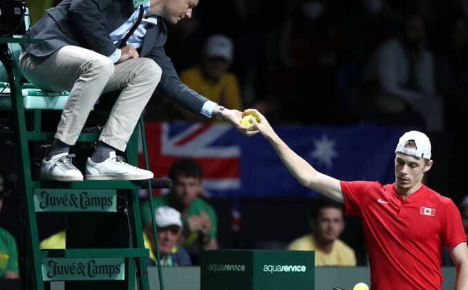 Day Six - Davis Cup Finals 2022 MALAGA, SPAIN - NOVEMBER 27: Denis Shapovalov of Canada takes a ball from judge during the Davis Cup by Rakuten Finals 2022 Final match between Australia and Canada at Palacio de los Deportes Jose Maria Martin Carpena on November 27, 2022 in Malaga, Spain. SanjinxStrukic PIXSELL