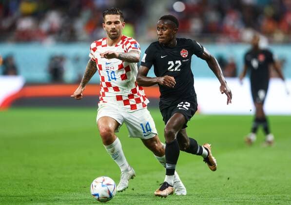 Mandatory Credit: Photo by Kieran McManus Shutterstock (13634907ap) Marko Livaja of Croatia and Richie Laryea of Canada Croatia v Canada, FIFA World Cup, WM, Weltmeisterschaft, Fussball 2022, Group F, Football, Khalifa International Stadium, Ar-Rayyan, Qatar - 27 Nov 2022 Editorial Use Only Croatia v Canada, FIFA World Cup 2022, Group F, Football, Khalifa International Stadium, Ar-Rayyan, Qatar - 27 Nov 2022 Editorial Use Only Copyright: xKieranxMcManus Shutterstockx 13634907ap