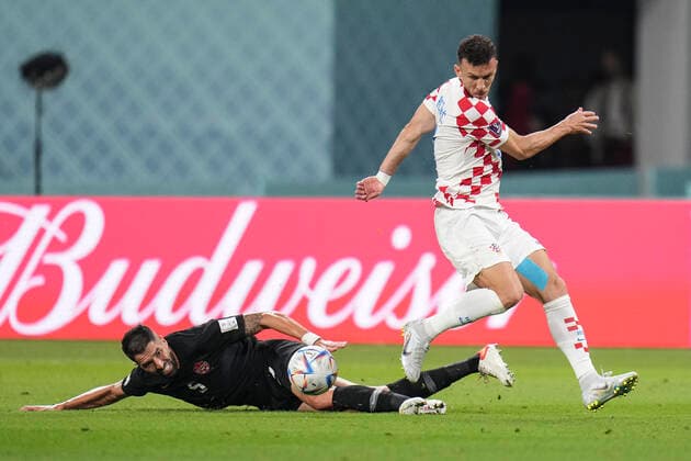 (221127) -- DOHA, Nov. 27, 2022 -- Ivan Perisic (Top) of Croatia vies with Steven Vitoria of Canada during the Group F match between Croatia and Canada at the 2022 FIFA World Cup, WM, Weltmeisterschaft, Fussball at Khalifa International Stadium in Doha, Qatar, Nov. 27, 2022. ) (SP)QATAR-DOHA-2022 WORLD CUP-GROUP F-CRO VS CAN MengxDingbo 