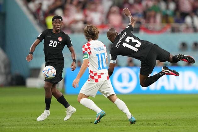 November 27, 2022, AL RAYYAN, QATAR: Croatia midfielder Luka Modric (10) looks to play the ball as Canada midfielder Atiba Hutchinson (13) and forward Jonathan David (20) look on during first half group F World Cup soccer action at the Khalifa International Stadium in Al Rayyan, Qatar on Sunday, November 27, 2022. Canada News - November 27, 2022  - ZUMAc35_ 20221127_zaf_c35_040 Copyright: xNathanxDenettex