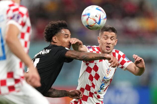 November 27, 2022, AL RAYYAN, QATAR: Croatia forward Andrej Kramaric (9) plays the ball in front of Canada forward Tajon Buchanan (11) during first half group F World Cup soccer action at the Khalifa International Stadium in Al Rayyan, Qatar on Sunday, November 27, 2022. Canada News - November 27, 2022  - ZUMAc35_ 20221127_zaf_c35_053 Copyright: xNathanxDenettex