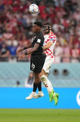 November 27, 2022, AL RAYYAN, QATAR: Canada forward Jonathan David (20) and Croatia defender Josko Gvardiol (20) go up to play the ball during first half group F World Cup soccer action at the Khalifa International Stadium in Al Rayyan, Qatar on Sunday, November 27, 2022. Canada News - November 27, 2022  - ZUMAc35_ 20221127_zaf_c35_058 Copyright: xNathanxDenettex