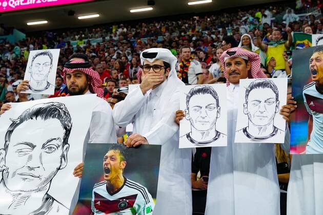 FIFA World Cup 2022, Spain - Germany, fans with Özil posters