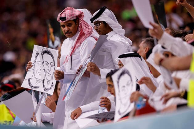 spain vs germany AL-KHOR, AK - 27.11.2022: SPAIN VS GERMANY - Arabs display posters and photos of Metsut Ozil during a match between Spain and Germany, valid for the group stage of the World Cup, held at Al Bayt Stadium in Al-Khor, Qatar. (Photo: Marcelo Machado de Melo Fotoarena) x2300427x  MarceloxMachadoxdexMelo