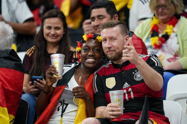 AL KHOR, QATAR - NOVEMBER 27: Supporters of Germany with a banner pose for a photo before the FIFA World Cup, WM, Weltmeisterschaft, Fussball Qatar 2022 group E match between Spain and Germany at Al Bayt Stadium on November 27, 2022 in Al Khor, Qatar. (Photo by Florencia Tan Jun PxImages Icon Sportswire) SOCCER: NOV 27 FIFA World Cup - Germany v Spain Icon221127371