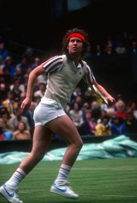 John McEnroe chasing down a lob at Wimbledon, 1980 John McEnroe chasing down a lob at Wimbledon, 1980