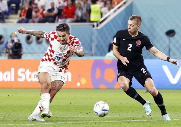 Football World Cup in Qatar Croatia s Marko Livaja (L) scores a goal during the first half of a World Cup Group F football match against Canada at Khalifa International Stadium in Doha, Qatar, on Nov. 27, 2022.  A14AA0001364875P 