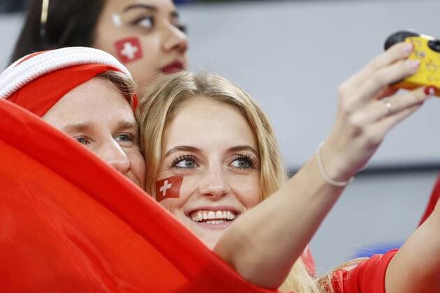 Football World Cup in Qatar Switzerland supporters take a selfie in the stands ahead of a World Cup Group G football match against Brazil at Stadium 974 in Doha, Qatar, on Nov. 28, 2022.  A14AA0001365643P 