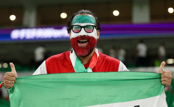 (221129) -- DOHA, Nov. 29, 2022 -- A fan of Iran cheers for the team before the Group B match between Iran and the United States at the 2022 FIFA World Cup, WM, Weltmeisterschaft, Fussball at Al Thumama Stadium in Doha, Qatar, Nov. 29, 2022. ) (SP)QATAR-DOHA-2022 WORLD CUP-GROUP B-IRN VS USA CaoxCan 