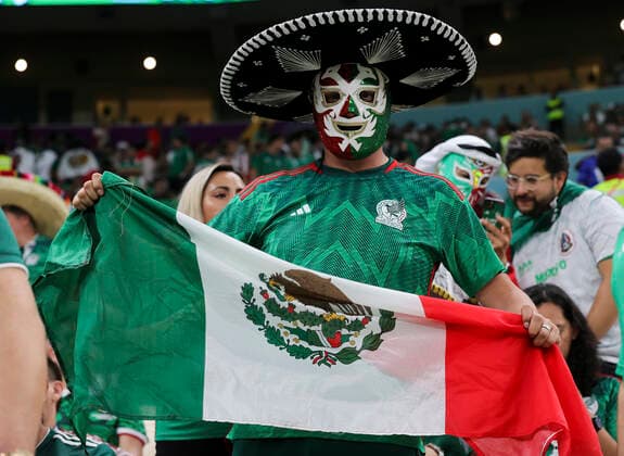 Saudi Arabia v Mexico 2022 FIFA World Cup, WM, Weltmeisterschaft, Fussball A Mexico fan wearing a mask and holding flag before the 2022 FIFA World Cup Group C match at Lusail Stadium, Lusail Content Not Available For UK Newspapers Copyright: xPaulxChestertonx FIL-17655-0003 UK Newspapers OUT