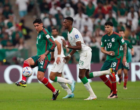 Saudi Arabia v Mexico 2022 FIFA World Cup, WM, Weltmeisterschaft, Fussball Edson Alvarez of Mexico is pressured by Mohamed Kanno of Saudi Arabia during the 2022 FIFA World Cup Group C match at Lusail Stadium, Lusail Content Not Available For UK Newspapers Copyright: xPaulxChestertonx FIL-17655-0052 UK Newspapers OUT