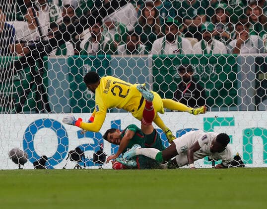 Saudi Arabia v Mexico 2022 FIFA World Cup, WM, Weltmeisterschaft, Fussball Henry Martin of Mexico colludes with Saudi Arabia goalkeeper Mohammed Al-Owais during the 2022 FIFA World Cup Group C match at Lusail Stadium, Lusail Content Not Available For UK Newspapers Copyright: xPaulxChestertonx FIL-17655-0054 UK Newspapers OUT