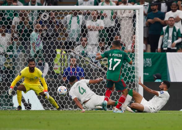 Saudi Arabia v Mexico 2022 FIFA World Cup, WM, Weltmeisterschaft, Fussball Orbelin Pineda of Mexico has a shot at goal as he jumps over the tackle from Abdulelah Al-Amri and Ali Al-Hassan of Saudi Arabia during the 2022 FIFA World Cup Group C match at Lusail Stadium, Lusail Content Not Available For UK Newspapers Copyright: xPaulxChestertonx FIL-17655-0084 UK Newspapers OUT