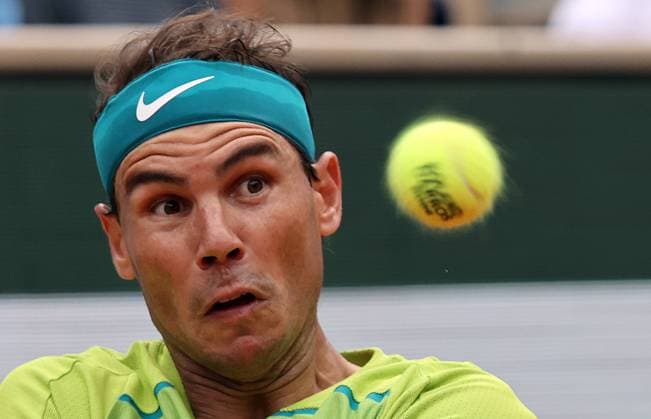 Rafael Nadal of Spain returns the ball to Casper Ruud of Norway during the Men s French Open s final at Roland Garros, outside Paris, France, on Sunday, June 5, 2022. Nadal won the title 6-3, 6-3, 6-0.  POY2022S122 MAYAxVIDON-WHITE