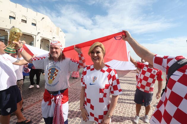Former President of Croatia with Croatian fans - FIFA World Cup, WM, Weltmeisterschaft, Fussball Qatar 2022 Former President of Croatia Kolinda Grabar-Kitarovic holds a 200 meters long flag with Croatian fans to support the national team, Nationalteam ahead of the match against Belgium in Doha, Qatar, on December 01, 2022. GoranxStanzl PIXSELL