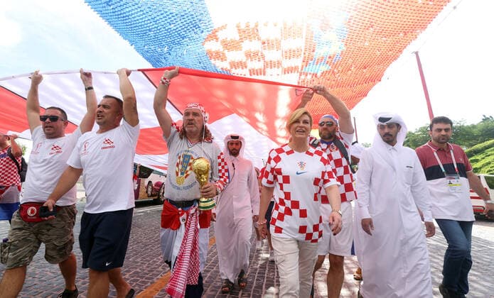 Former President of Croatia with Croatian fans - FIFA World Cup, WM, Weltmeisterschaft, Fussball Qatar 2022 Former President of Croatia Kolinda Grabar-Kitarovic holds a 200 meters long flag with Croatian fans to support the national team, Nationalteam ahead of the match against Belgium in Doha, Qatar, on December 01, 2022. GoranxStanzl PIXSELL