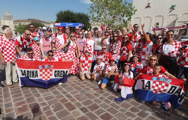 Former President of Croatia with Croatian fans - FIFA World Cup, WM, Weltmeisterschaft, Fussball Qatar 2022 Former President of Croatia Kolinda Grabar-Kitarovic pose with Croatian supporters ahead of the match against Belgium in Doha, Qatar, on December 01, 2022. GoranxStanzl PIXSELL