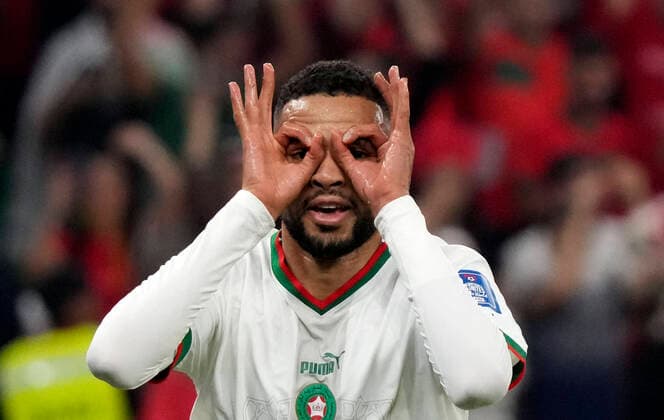 (221201) -- DOHA, Dec. 1, 2022 -- Youssef En-Nesyri of Morocco celebrates after scoring during the Group F match between Canada and Morocco at the 2022 FIFA World Cup, WM, Weltmeisterschaft, Fussball at Al Thumama Stadium in Doha, Qatar, Dec. 1, 2022. ) (SP)QATAR-DOHA-2022 WORLD CUP-GROUP F-CAN VS MAR LixGang 