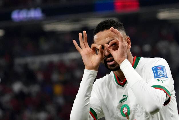 (221201) -- DOHA, Dec. 1, 2022 -- Youssef En-Nesyri of Morocco celebrates after scoring team s second goal during the Group F match between Canada and Morocco at the 2022 FIFA World Cup, WM, Weltmeisterschaft, Fussball at Al Thumama Stadium in Doha, Qatar, Dec. 1, 2022. ) (SP)QATAR-DOHA-2022 WORLD CUP-GROUP F-CAN VS MAR LixGang 